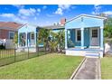 Two light blue houses with a shared yard and walkway at 2483 13Th N Ave, St Petersburg, FL 33713