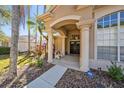 Elegant entryway with columns and a welcoming porch at 8507 Portage Ave, Tampa, FL 33647