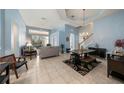 Bright and airy living area with a view into the kitchen and dining area at 8507 Portage Ave, Tampa, FL 33647