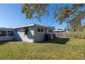 Spacious backyard with mature trees and partially fenced at 10273 109Th Ave, Largo, FL 33773