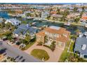 Luxury waterfront home with circular driveway, and private boat dock at 119 8Th E St, Tierra Verde, FL 33715