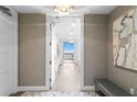 Bright condo entryway with hardwood floors and art at 3401 Bayshore Blvd # 1904, Tampa, FL 33629