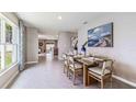 Bright dining area with hardwood floors and a view to kitchen at 36076 Sunflower Hill Dr, Zephyrhills, FL 33541