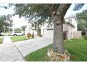 Side view of a house showcasing the garage and driveway at 504 Maple Pointe Dr, Seffner, FL 33584
