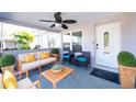 Inviting front porch with seating area, ceiling fan, and potted plants at 5808 Dartmouth N Ave, St Petersburg, FL 33710