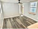 Spacious living room featuring light gray walls and wood-look flooring at 9790 66Th N St # 74, Pinellas Park, FL 33782