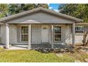 Brick home with covered porch and entryway at 1025 Fairwood Ave, Clearwater, FL 33759