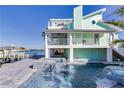 Luxury waterfront home with a beautiful pool and spa at 17410 1St E St, Redington Shores, FL 33708