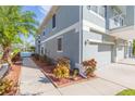 Landscaped walkway leading to the home's entrance at 8423 Blue Rock Dr, New Port Richey, FL 34653