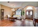 Spacious living room with hardwood floors and a view of the entryway at 12922 Prestwick Dr, Riverview, FL 33579