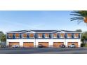 View of the back of the property showcasing the garages and parking area at 13750 Park Blvd # 3, Seminole, FL 33776