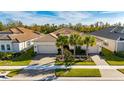 Luxury home with a tile roof and a large yard at 15314 Valencia Del Sol St, Wimauma, FL 33598