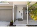 White front door entrance with a covered porch at 2085 Georgianna St, Largo, FL 33774