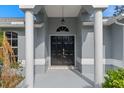 Elegant entryway with columns and double doors at 22921 Sterling Manor Loop, Lutz, FL 33549