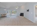 Spacious living room with fireplace and view of the pool at 22921 Sterling Manor Loop, Lutz, FL 33549