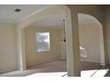 Bright dining room with arched entryways and neutral colors at 10514 Sleepy Orange Ct, Riverview, FL 33578