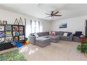 Spacious living room with sectional sofa and built-in shelving at 25028 Hyde Park Blvd, Land O Lakes, FL 34639