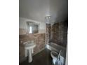 Bathroom with pedestal sink, bathtub, and toilet at 3505 E Mcberry St, Tampa, FL 33610