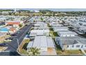 Aerial view of a mobile home community showcasing numerous homes and amenities at 37820 Madeira Ave, Zephyrhills, FL 33541