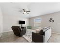 Living room with tiled floors, comfy seating and a large TV at 6807 King Creek Dr, Sun City Center, FL 33573