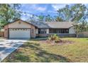 Brick and siding home with a two car garage at 9502 59Th E Ave, Bradenton, FL 34202