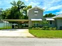 House exterior with carport and additional building in the backyard at 1003 Beverly Ave, Largo, FL 33770