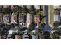 Aerial perspective of a residential neighborhood, showcasing home styles and street layout at 4219 Beaumont Loop, Spring Hill, FL 34609