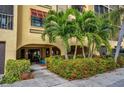 Attractive building entrance with lush landscaping and walkway at 5817 Park N St # 204, St Petersburg, FL 33709