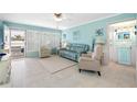Bright living room with light tile floors and comfy seating at 5820 43Rd N Ter # 1403, St Petersburg, FL 33709