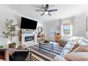 Cozy living area with a fireplace, comfortable seating, and lots of natural light at 727 53Rd N Ter, St Petersburg, FL 33703