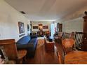 Bright living room with hardwood floors and comfy seating at 8311 Fountain Ave, Tampa, FL 33615