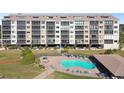 Building exterior with pool and patio area at 4650 Bay Blvd # 1046, Port Richey, FL 34668