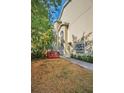 Small backyard with red deck and tropical plants at 609 S Glen Ave # B, Tampa, FL 33609