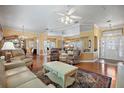 Open living space with hardwood floors and a large mirror adding depth at 705 Loma Linda Ct, Brandon, FL 33511