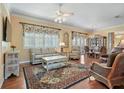 Spacious living area with hardwood floors, ample natural light, and comfortable furniture at 705 Loma Linda Ct, Brandon, FL 33511