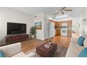 Open concept living and kitchen area with hardwood floors and modern appliances at 2262 Swedish Dr # 12, Clearwater, FL 33763