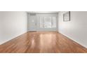 Empty living room with hardwood floors and lots of natural light at 2262 Swedish Dr # 12, Clearwater, FL 33763