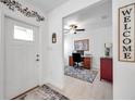 Bright entryway with view into an office and wood-look floors at 31371 Cabana Rye Ave, San Antonio, FL 33576