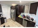 Kitchen with stainless steel appliances and ample counter space at 1104 Winchester N Rd, St Petersburg, FL 33710