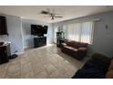 Bright living room featuring a large TV and comfy seating at 1104 Winchester N Rd, St Petersburg, FL 33710
