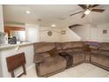 Spacious living room with sectional sofa and view of kitchen at 2633 Edgewater Falls Dr, Brandon, FL 33511