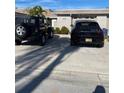 Two-car driveway with a black Jeep and Porsche at 569 Boca Ciega Point N Blvd # 2602, St Petersburg, FL 33708