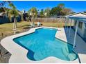 Sparkling blue pool surrounded by a spacious patio area at 6216 Fairway Blvd, Apollo Beach, FL 33572