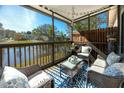 Relax on the screened porch with a view of the pond and fountain at 6388 93Rd N Ter # 4603, Pinellas Park, FL 33782