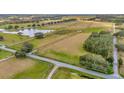 Aerial view showing a large lot with road access and neighboring properties at 9229 Fort King Rd Rd, Dade City, FL 33525