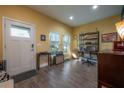 Home office with wood floors and a view of the front door entry at 105 W Osborne Ave, Tampa, FL 33603