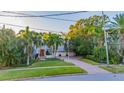 Charming two-story home with lush landscaping and brick driveway at 334 Blanca Ave, Tampa, FL 33606
