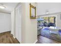 Hallway with white closet doors and wood floors at 3515 41St S Ter # 221, St Petersburg, FL 33711
