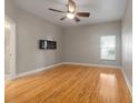 Bright bedroom with hardwood floors and ceiling fan at 3804 N Arlington Ave, Tampa, FL 33603