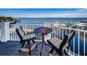 Enjoy water views from this balcony, complete with a small table and chairs at 1860 N Fort Harrison Ave # 104, Clearwater, FL 33755